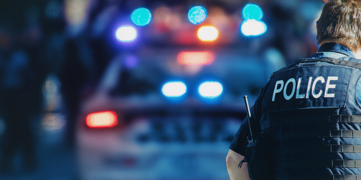 policeman-with-police-car